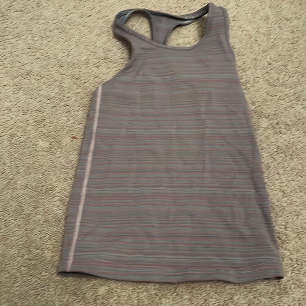 Ivivvia tank top, size 8. Fits true 8. Very stretchy, purple and teals